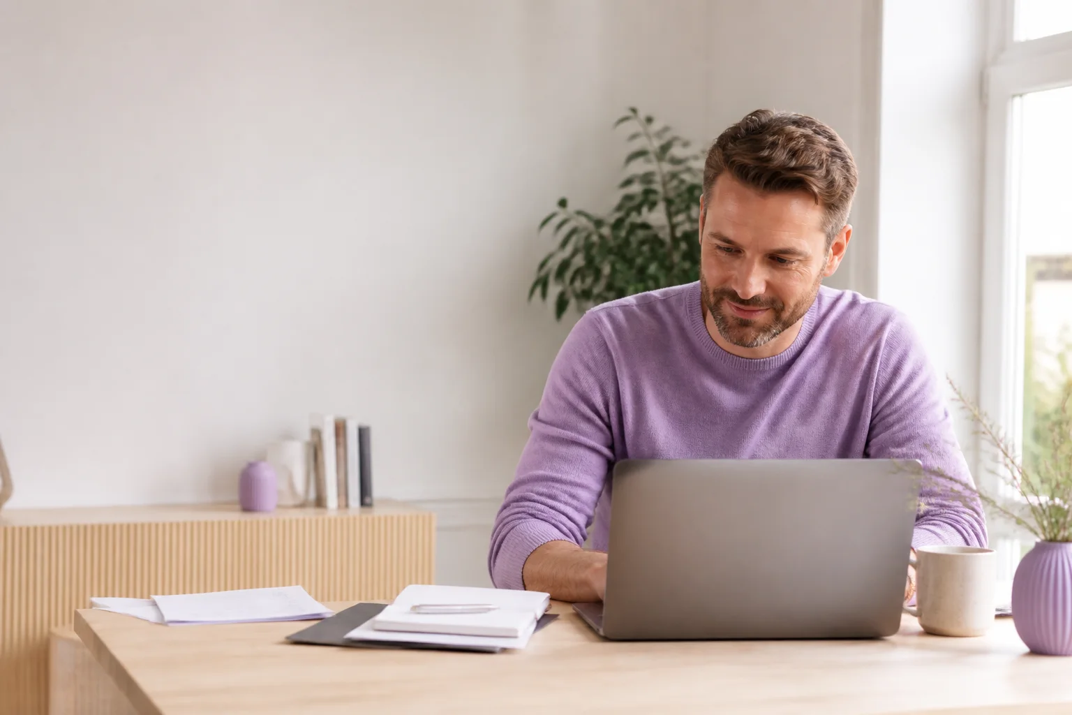Business owner reviewing a website on a laptop